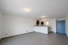 Séjour avec cuisine ouverte, Appartement T3 à Saint-Benoît (97470), Stellar Immobilier